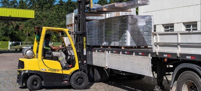 a forklift truck loading pallets